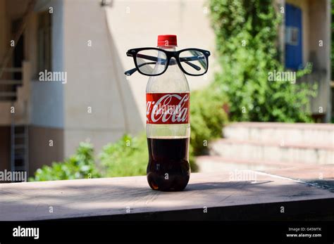 A Coca Cola Bottle With Spectacles Stock Photo Alamy