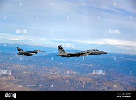 A U S Air Force F 15 Eagle And An F 16C Fighting Falcon Fly Over The Skies Of Fresno California