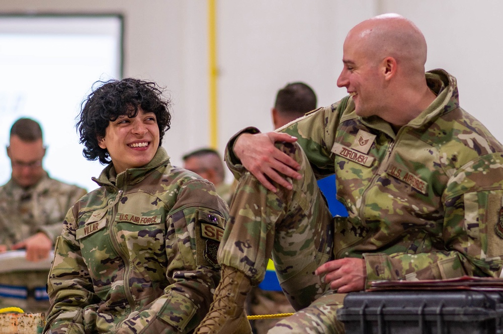 An Airmen From The 375Th Air Mobility Wing Performs A Buddy Carry In A Hangar On Volk Field Air