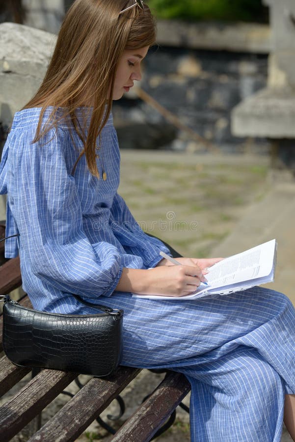 Female Hand With Pen Completing Personal Information On Form Business