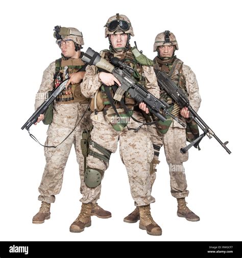 Full Length Group Portrait Of U S Marines In Combat Uniforms Armed With Weapons Stock Photo