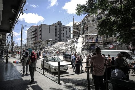 Gaza City Gaza May 22 Palestinians Pass By Destroyed Buildings After Mutual And