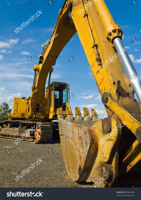 Heavy Duty Construction Equipment Parked At Worksite Stock Photo By