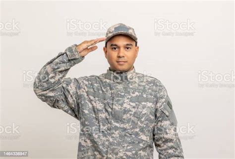 Saluting Asian Man Special Forces Soldier Standing In Studio Commander