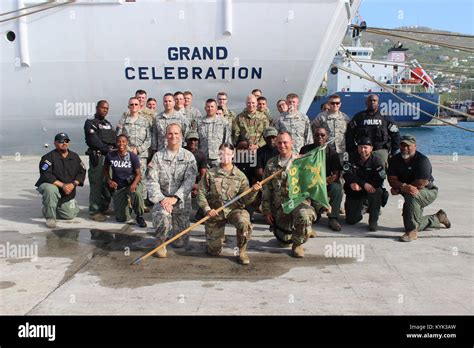 Soldiers With The 940Th Military Police Company Take A Group Photo With Members Of The Virgin