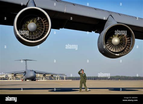 U S Air Force Crew Chief Performs A Post Flight Inspection On A C 5 Galaxy Stock Photo Alamy