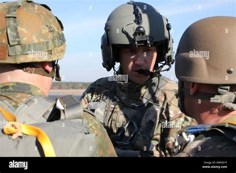 U S Army Flight Member Speaks With U S Army Paratroopers Before Flight During The 20Th Annual