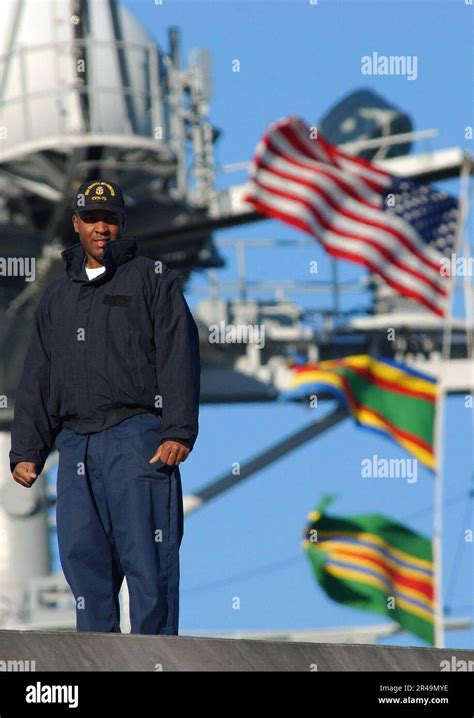 Us Navy A Sailor Stands On The Fantail Of The Uss George Washington Cvn 73 For A Last Look At