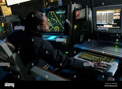 Us Navy Air Traffic Controller 2Nd Class Petty Officer Monitors Both The Approach A And Approach