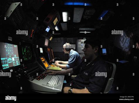 Us Navy Cryptologic Technicians Monitor Electronic Emissions In The Electronic Warfare Module