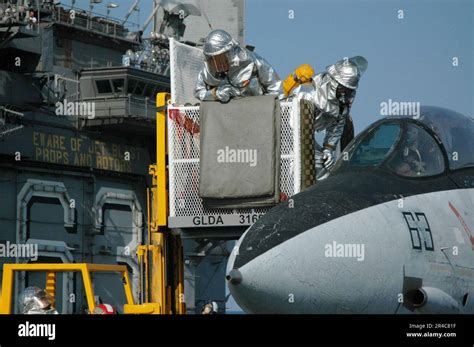 Us Navy The Crash And Salvage Division Aboard The Conventionally Powered Aircraft Carrier Uss