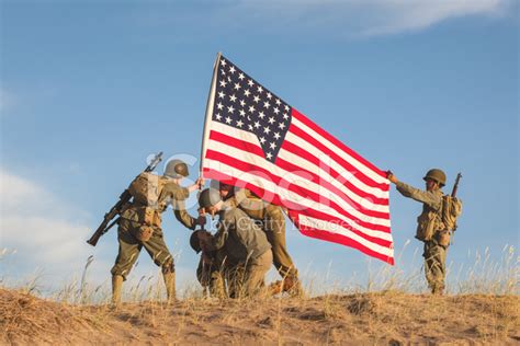 Patriotism in Action: US Soldiers with the American Flag