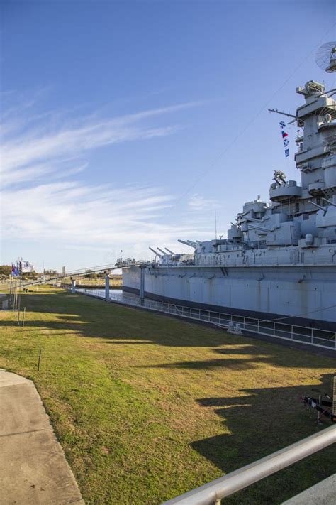 Uss Alabama Battleship Memorial Park With The Uss Alabama Battleship Surrounded By Lush Green