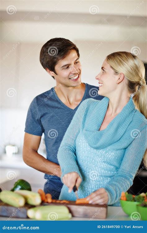 Whats Cooking Good Looking A Happy Young Couple Sharing An Affectionate Moment Together While